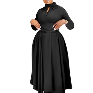 Detailed close-up of beaded high neck design and cutout on black elegant dress