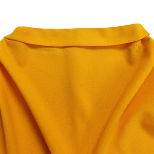 Detail of elegant bright yellow pleated neckline on a polyester crepe texture dress