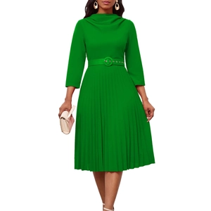Detail of elegant green pleated dress featuring chic scarf collar and wide belted waistline