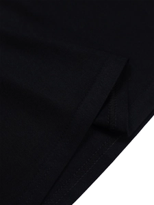 Detail of high-density black knit fabric showing premium double-needle hem stitching