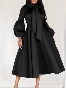 Elegant black A-line dress with puff sleeves and large bow-tie neck for formal occasions