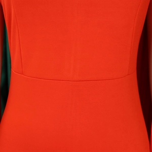Close-up of fine stitching and waist pleats on this elegant red party dress fabric