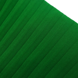 Macro view of green pleated fabric texture on this elegant polyester evening dress