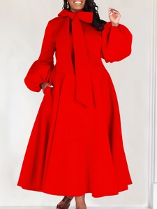 Elegant red dress with large bow-tie collar, puff sleeves and flowy A-line skirt style