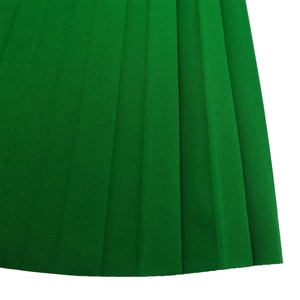Detail of elegant pleated grass green fabric texture on a fashion maxi dress