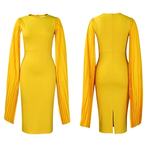 Detail of elegant pleated long sleeves and bodycon fit on this yellow evening dress