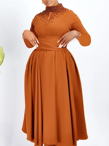Elegant orange high-neck maxi dress with beaded neckline and pleated waist detailing