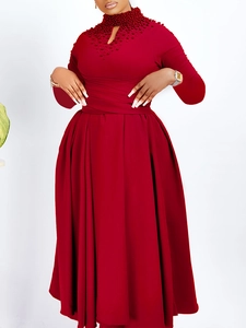 Elegant wine red long sleeve dress with pearl details and a pleated flowy skirt