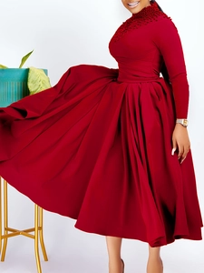 Elegant dark red high neck evening dress with pearl beadwork and large pleated skirt