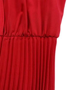 Detail of red elastic waist with fine pleats on lightweight woven dress fabric