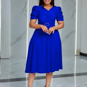 Detail of royal blue V-neck dress with puff sleeves and belt with square buckle