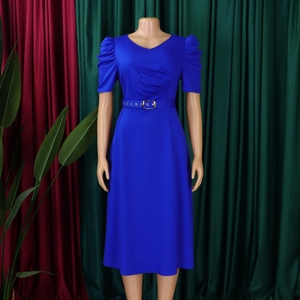 Detailed view of royal blue V-neck dress with pleated puff sleeves and belted waistline