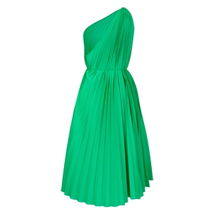 Detail of green one-shoulder pleated dress showing intricate accordion folds and fabric texture