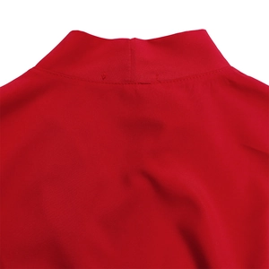 Detail view of red high neck dress showing neat collar stitching and soft blend fabric