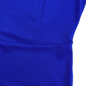 Macro shot of royal blue knit fabric showing precise waistline stitching and texture