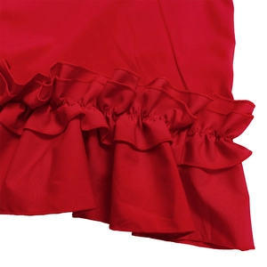 Detail of red dress featuring double-layered ruffled hem and precise stitching craft
