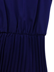 Detail of high waist elastic smocking and fine pleats on dark blue African dress