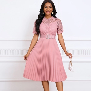 Detail of pink lace bodice and fine pleated skirt featuring a matching buckle belt