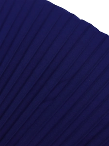 Detailed macro shot showing navy blue pleated fabric texture on a women dress