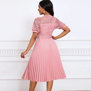 Back view of pink lace patchwork pleated dress with short sleeves and waist belt