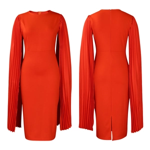 Detail view of red bodycon evening dress featuring pleated cape sleeves and a back slit
