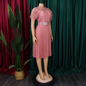 Pink lace midi dress with puff sleeves, pleated skirt and matching belt detail view
