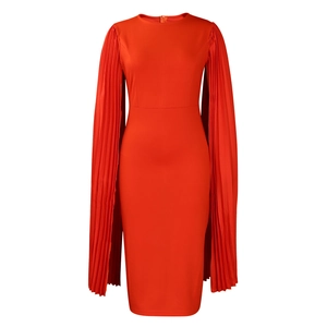 Detailed view of bright red dress showing pleated long sleeves and textured fabric