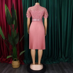Rear view of pink lace short sleeve dress featuring elegant pleats and matching belt