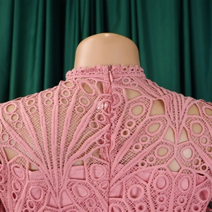 Detail of pink lace dress back with high collar and invisible zipper closure