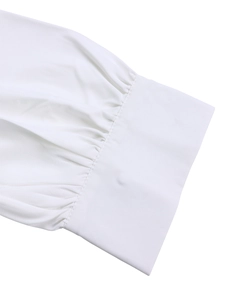 Detailed view of elegant white dress sleeve with pleated cuffs and high-density cotton texture