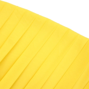 Macro shot of bright yellow pleated fabric showing fine texture and rhythmic folds