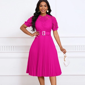 Detail of fuchsia pleated dress with intricate lace bodice and matching buckled waist belt