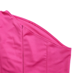 Detailed close-up of hot pink high waist jumpsuit with invisible side zipper and stitching