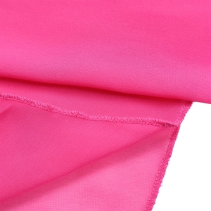 Macro detail of rose pink chiffon fabric texture and high-quality overlock stitching edge