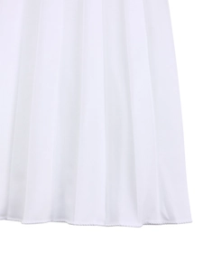 Close-up of the pleated hem and neat stitching on a crisp white polyester dress