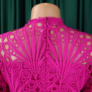 Detail of rose red hollow lace dress featuring geometric cutouts and back invisible zipper
