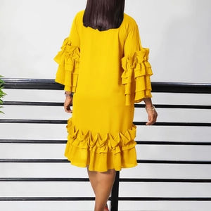 Rear view of yellow midi dress featuring tiered ruffle sleeves and layered hemline detail