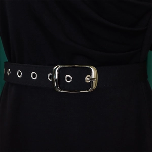 Detailed close-up of a black canvas belt with silver metal grommets and a square buckle