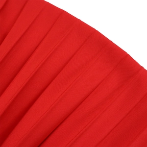 Detailed macro view of vibrant red pleated fabric with uniform texture and high elasticity