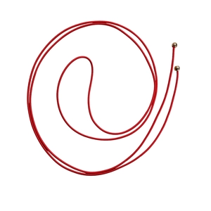 Detail of red elastic cord with metallic gold ball end caps in a spiral arrangement