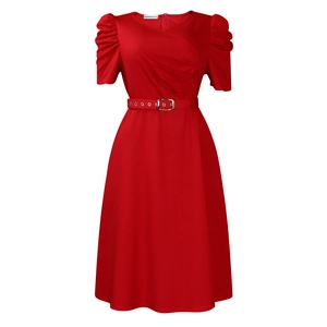 Detail of red V-neck dress featuring puff sleeves and an elegant buckled waist belt