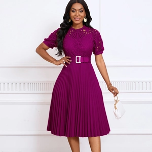 Detail of elegant magenta lace bodice with pleated skirt and metallic buckle belt