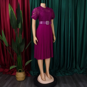 Detail of magenta dress featuring intricate lace hollow-out work and bubble short sleeves