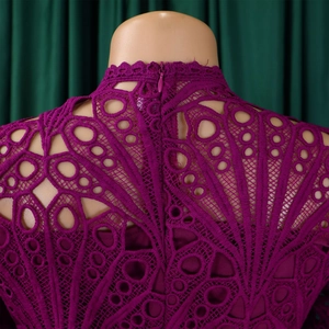 Detailed view of purple lace neckline and back invisible zipper on a party dress