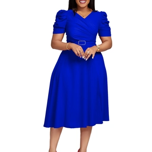 Close-up of bright blue V-neck dress featuring pleated bodice and belted waist with buckle