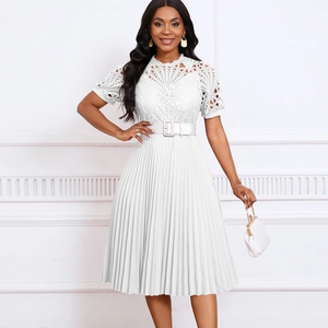 Detail of white lace bodice and pleated skirt with a matching belt on a stylish dress
