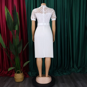 Detail view of the white lace patchwork and pleated back on this African party dress