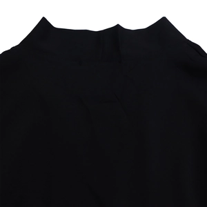 Detailed macro view of black high neck collar and smooth knit fabric texture