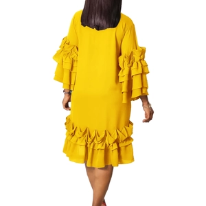 Detail view of multi-layer ruffled sleeves on a vibrant yellow summer fashion dress