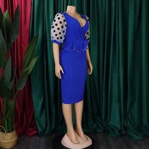 Detail view of royal blue pencil dress with polka dot mesh sleeves and waist ruffle